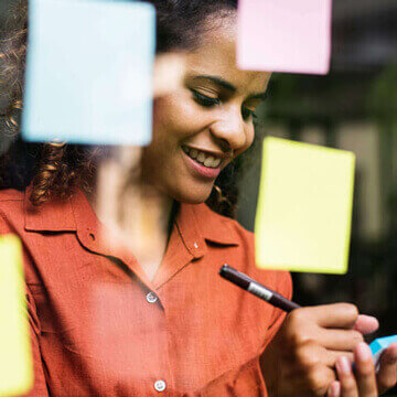 Woman using sticky notes